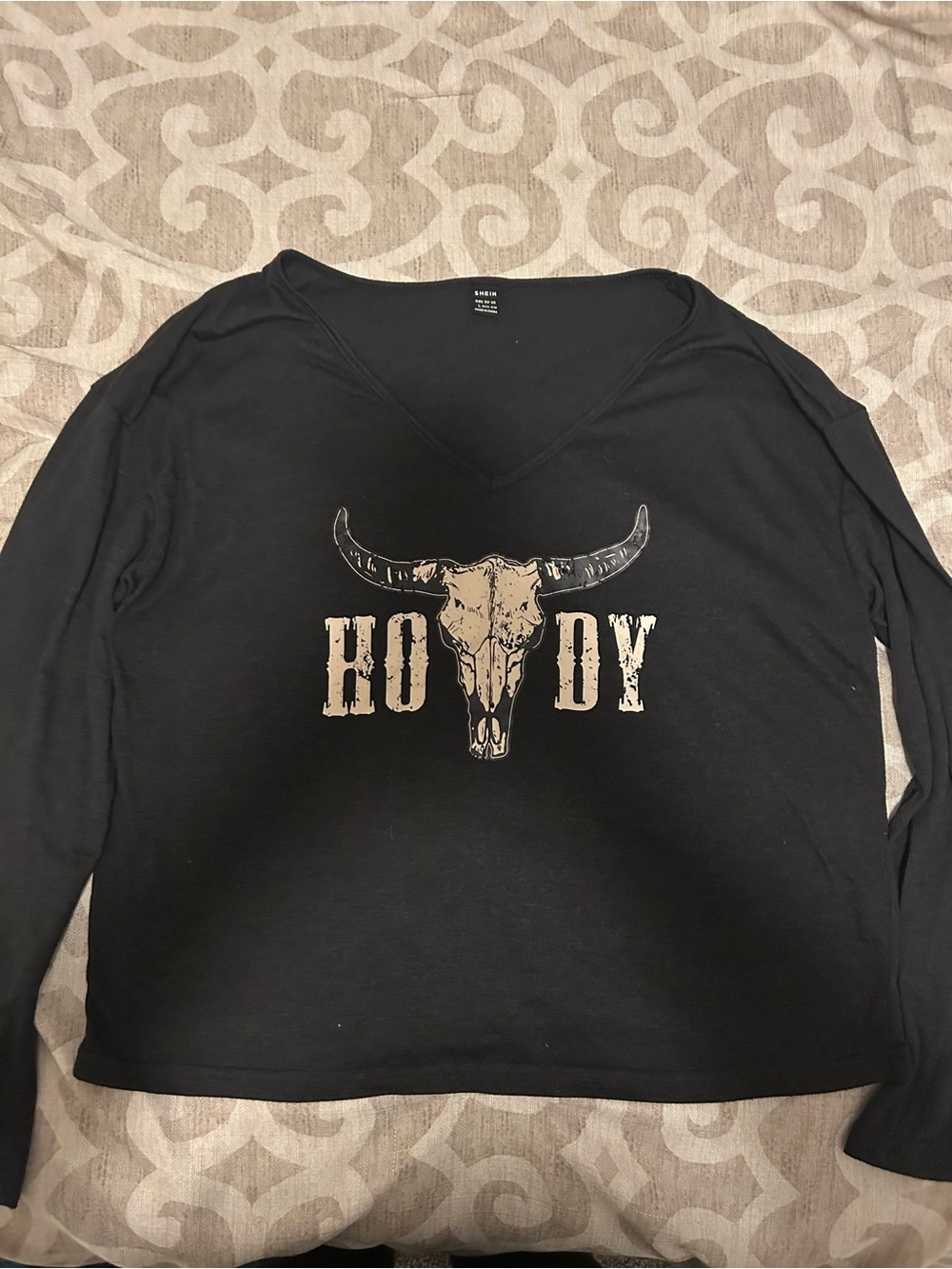 SHEIN Black Long Sleeve V-Neck Top with Beige Skull 'Howdy' Graphic